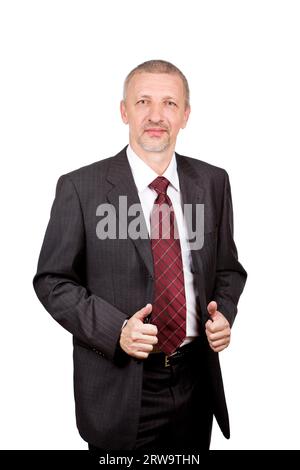 Elegante uomo d'affari maturo in piedi e con la sua tuta. Isolato su bianco Foto Stock