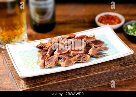 Gizzard di anatra marinata in salsa piccante Foto Stock