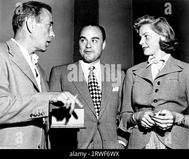 HUMPHREY BOGART e LAUREN BACALL con (in mezzo) Unidentified Man intorno al 1949 Foto Stock