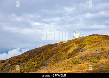 Autumn foliage scenery of the Myoko Mountains seen from the highest point of the Sado Island Sado Skyline and ATC radar of the Air Self-Defense Force Stock Photo