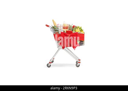 Foto studio di un carrello pieno legato con un fiocco di nastro rosso isolato su sfondo bianco Foto Stock