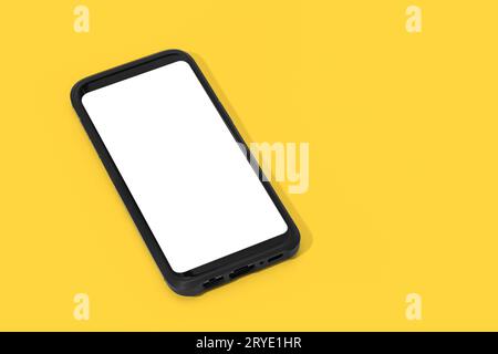 Smartphone con schermo bianco isolato su sfondo giallo Foto Stock