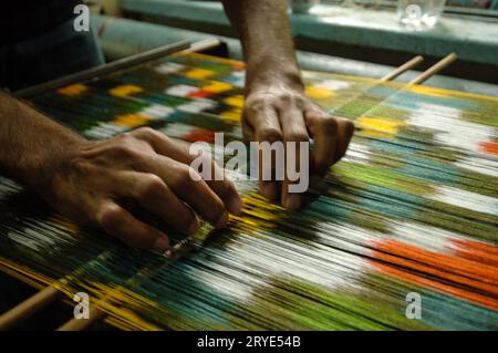 Produzione e tessitura di tappeti e tessuti Foto Stock