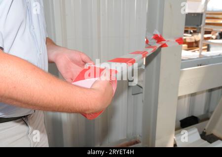 Nastro barriera a strisce rosse e bianche Foto Stock