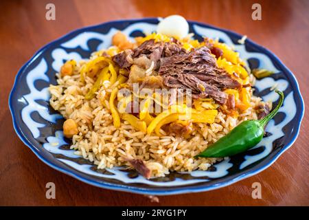 Pilaf o palov, dishÂ tradizionale dell'Uzbekistan. Foto Stock