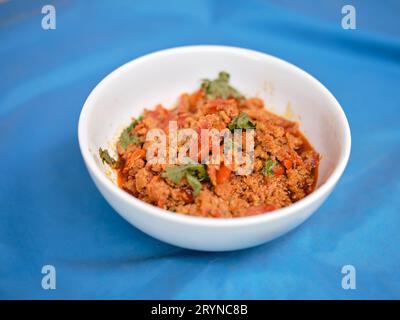 CIBO THAILANDESE, Nam Prik ONG, cibo thailandese settentrionale preparato con maiale macinato con pomodori e peperoni Foto Stock