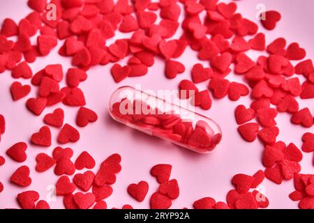 Capsule con il cuore. Illustrazione di San Valentino. Concetto. Foto Stock