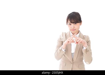 Donna d'affari che fa il segno batu Foto Stock