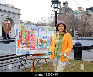 Ritratto in posa di un pittore che lavora a Washington Square Park nel Greenwich Village, New York City Foto Stock