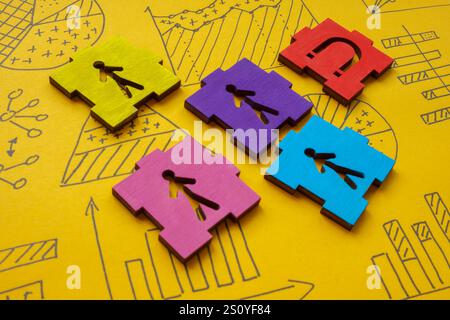 Magnete che attrae figure e grafici dei clienti. Acquisizione di clienti. Foto Stock