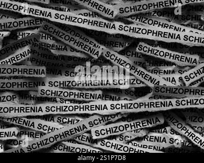 Strisce di giornali con le parole schizofrenia. Bianco e nero. Foto Stock