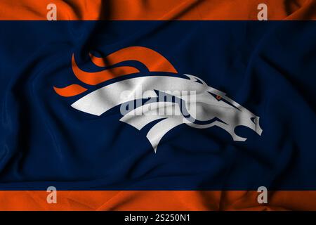 Pringsewu, Lampung; 5 gennaio 2025; texture di una bandiera ondulata con il logo della squadra di football americano della NFL Denver Broncos, Stati Uniti. 3D. Foto Stock