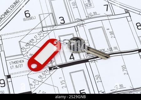 Un piano di costruzione di un architetto con la chiave di un appartamento o di una nuova casa Austria Foto Stock