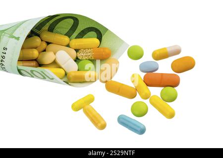 Tavolette e banconote da cento euro foto simbolica: Costi per la medicina e i farmaci dell'industria farmaceutica Foto Stock