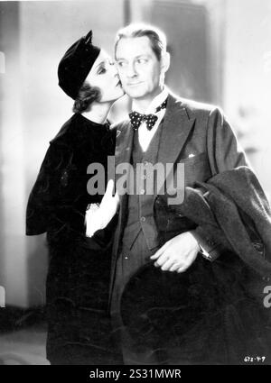 CENA ALLE OTTO KAREN MORLEY E LIONEL BARRYMORE data: 1933 Foto Stock