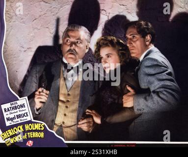 SHERLOCK HOLMES E LA VOCE DEL TERRORE Nigel Bruce, EVELYN ANKERS E BASIL RATHBONE una immagine universale data: 1942 Foto Stock