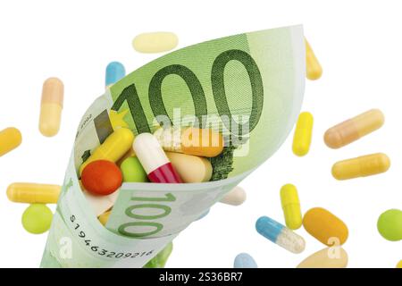 Tavolette e banconote da cento euro foto simbolica: Costi per la medicina e i farmaci dell'industria farmaceutica Austria Foto Stock