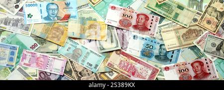 Molte banconote di valuta diversa. Sfondo di grandi quantità di banconote casuali primo piano. Molte banconote di valuta diversa. Sfondo di Foto Stock