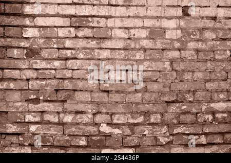 Primo piano di pareti in mattoni con sfumature di mocha-mousse, catturando il fascino rustico della vecchia architettura. Foto Stock
