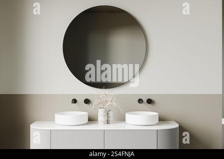 Interni minimalisti del bagno con un moderno doppio lavandino con due lavandini bianchi, finiture nere opache e un grande specchio rotondo contro un neu Foto Stock