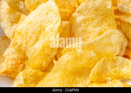 vista di sfondo della consistenza dello spuntino con patatine croccanti Foto Stock