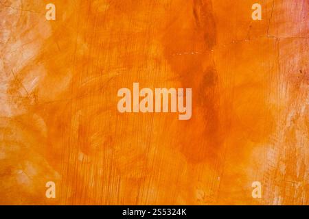 Parete testurizzata sfondo dipinto spazzolato, Abstract colore olio arancione Foto Stock