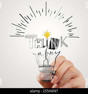 Disegno a mano la lampadina della spia e pensare word design come concetto Foto Stock