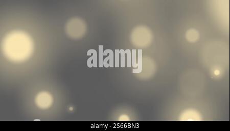 Immagine di macchie luminose luminose su sfondo grigio Foto Stock