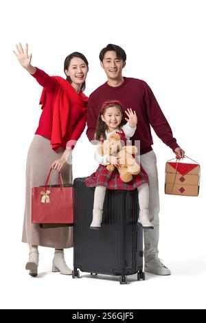 Famiglia felice che fa un viaggio di Capodanno Foto Stock