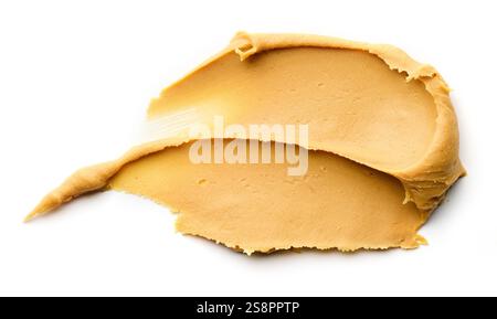 striscio di burro di arachidi isolato su sfondo bianco, vista dall'alto Foto Stock