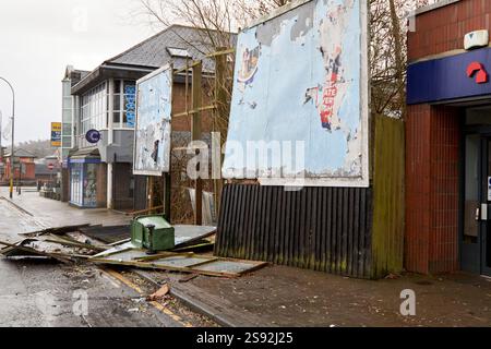 advertising hoarding damaged during high winds and fallen onto main road in red warning due to storm Eowyn ,glengormley, Newtownabbey, Northern Irelan Foto Stock