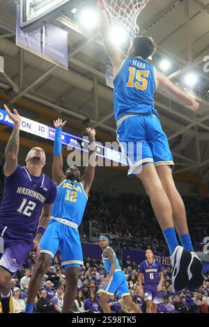 Il centro UCLA Bruins Aday Mara (15) blocca un tiro dalla guardia dei Washington Huskies Luis Kortright (12) durante la prima metà di una partita di basket al college all'Alaska Airlines Arena di Seattle, Washington, il 24 gennaio 2025. (Credito fotografico Nate Koppelman/Sipa USA) credito: SIPA USA/Alamy Live News Foto Stock
