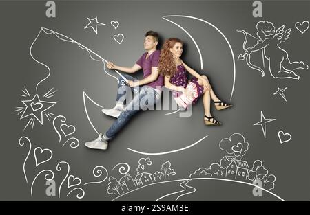 Happy valentines love story concetto di una coppia romantica la pesca su una luna con una stella su un gancio contro gesso disegni sullo sfondo di un cielo notturno e Foto Stock