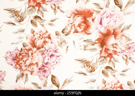 Frammento di colorato motivo in tessuto rétro con ornamento floreale utile come sfondo. Tessuto o tessuto floreale, foto macro. Trama del tessuto. ti Foto Stock