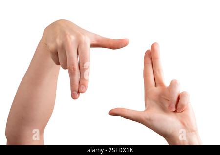 Mani femminili che formano un gesto di inquadratura, dita e pollice creando una prospettiva per la composizione, la creatività e il concetto di fotografia. Isolato su wh Foto Stock