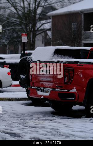 Snowy Parking Lot with Red Pickup Truck Foto Stock