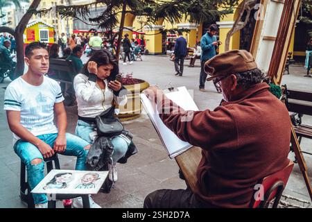 Street Artist Painting a Couple’s caricature – Centro de Lima Foto Stock