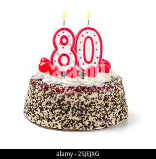 Torta di compleanno con candela che brucia numero 80 Foto Stock
