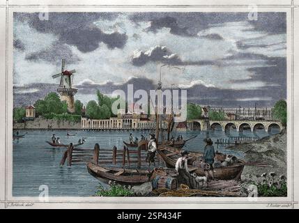 Amsterdam, Paesi Bassi. Vista sul fiume Amstel con le barche. Foto Stock