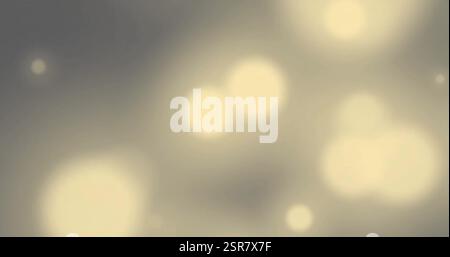 Immagine di macchie luminose luminose su sfondo grigio Foto Stock