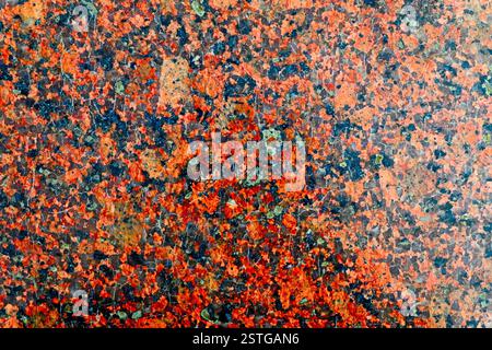 Alta granito lucido Texture. Base di rosso e nero con macchie di colore grigio. Foto Stock