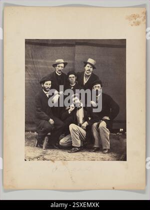 Fotografia di impiegati che lavorano nell'ufficio del secondo quartier generale a Camp Nelson, Kentucky, durante la guerra civile. L'immagine fu catturata da G. W. Foster o F. Glessner, mostrando i soldati nei loro ruoli amministrativi. La stampa in argento di albume dal vetro negativo rappresenta lo sforzo militare e le attività quotidiane al campo durante gli anni '1860 Foto Stock