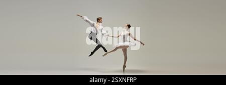 Banner. Duetto di balletto, giovane uomo e donna, vestiti elegantemente, eseguendo passi di danza classica, mostra tecnica e sinergia su sfondo bianco. Foto Stock
