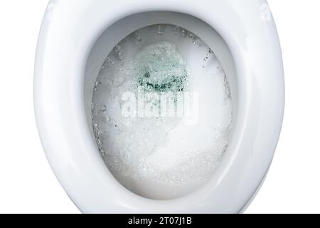 La ciotola della toilette è lavata con diversi litri di acqua potabile, spreco di risorse ambientali in tempi di riscaldamento climatico globale, vista dall'alto Foto Stock