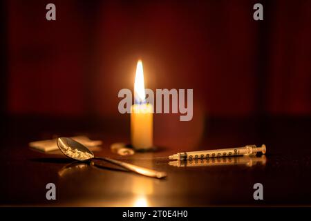 Iniezione, candela ed Eroina di un drogato Foto Stock
