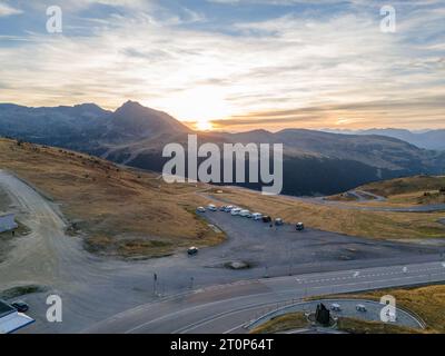 This aerial drone photo shows a group of campers on top of a mountain. The campers are wild camping and enjoying the view in Andorra. Foto Stock