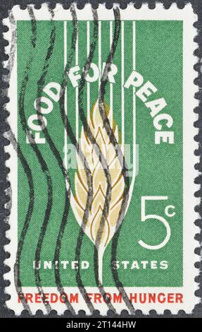Francobollo cancellato stampato dagli Stati Uniti, che mostra la campagna Wheat, Food for Peace - Freedom from Hunger, circa 1963. Foto Stock