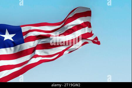 Bandiera nazionale della Liberia che sventola in una giornata limpida. strisce orizzontali rosse e bianche che cambiano colore e una stella bianca sul quadrato blu del cantone. Foto Stock