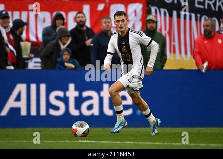 East Hartford, Stati Uniti. 14 ottobre 2023. Calcio: Internazionale, USA - Germania, Pratt & Whitney Stadium presso il Rentschler Field. Il tedesco Florian Wirtz gioca la palla. Credito: Federico Gambarini/dpa/Alamy Live News Foto Stock