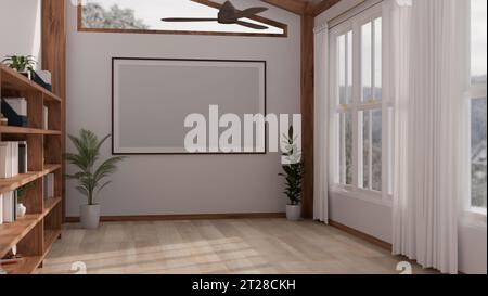 Un mockup a poster con cornice vuota su una parete bianca in una camera intima e minimalista con piante da casa, una libreria in legno, un pavimento in parquet, un ventilatore a soffitto e una finestra Foto Stock